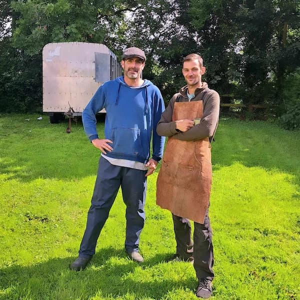 Reset team members standing next to mobile sauna